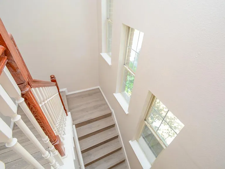 Stairs with High ceiling and side windows