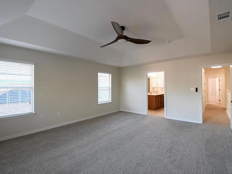 Master bedroom leading to private master bathroom