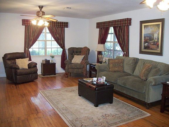 Spacious living area with original hard wood flooring.