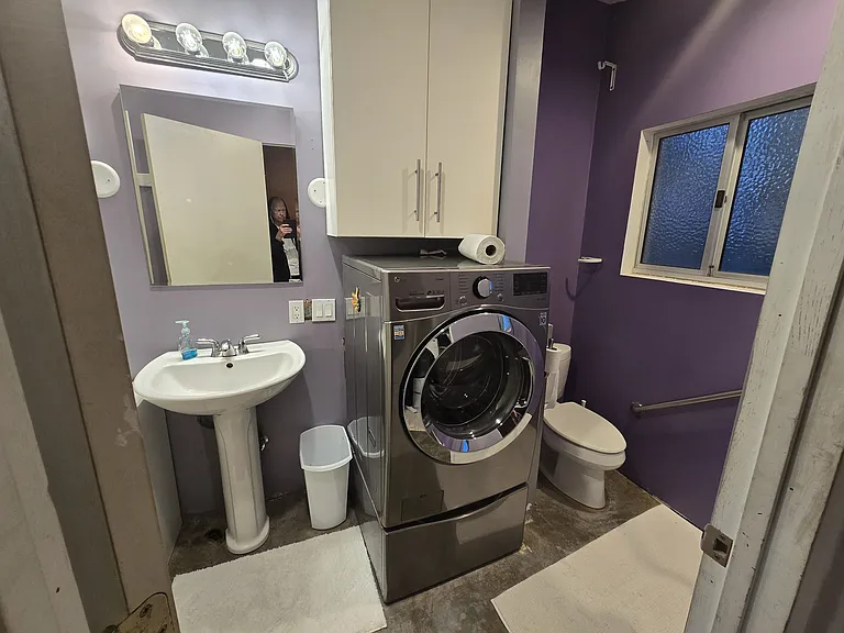 Washing machine is in the bathroom, but is remarkably quiet. We have been painting and there will be window coverings soon. Shelves above washer for towels, etc. Medicine cabinet is quiet large with 4 shelves.