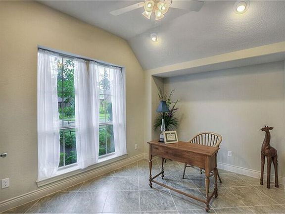 Light and bright study with high ceilings and great windows.