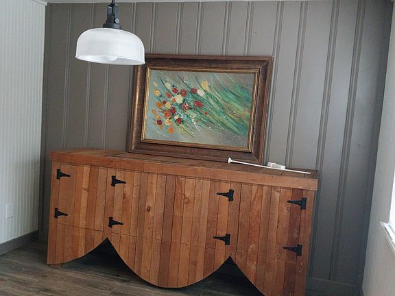 This beautiful handmade storage unit may stay with the house.
