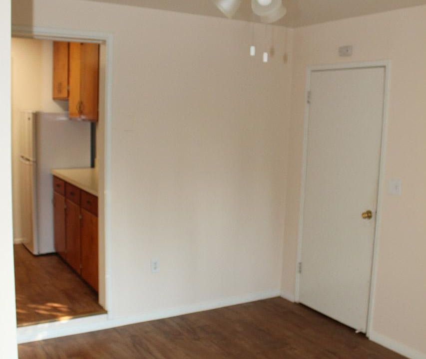 Front door view to storage room and kitchen..