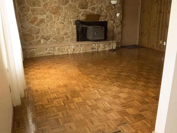 Living room with fireplace insert stove.