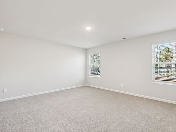 Primary bedroom in the Johnson floorplan at a Meritage Homes community in Garner, NC.