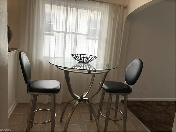 The open dining area has lots of natural light and is open to the living room.
