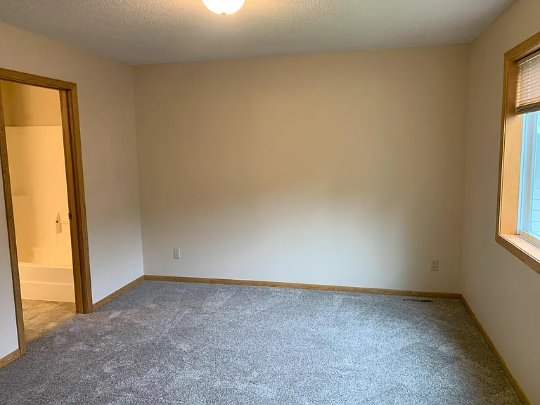 2nd photo of primary upper level bedroom with access to full bathroom