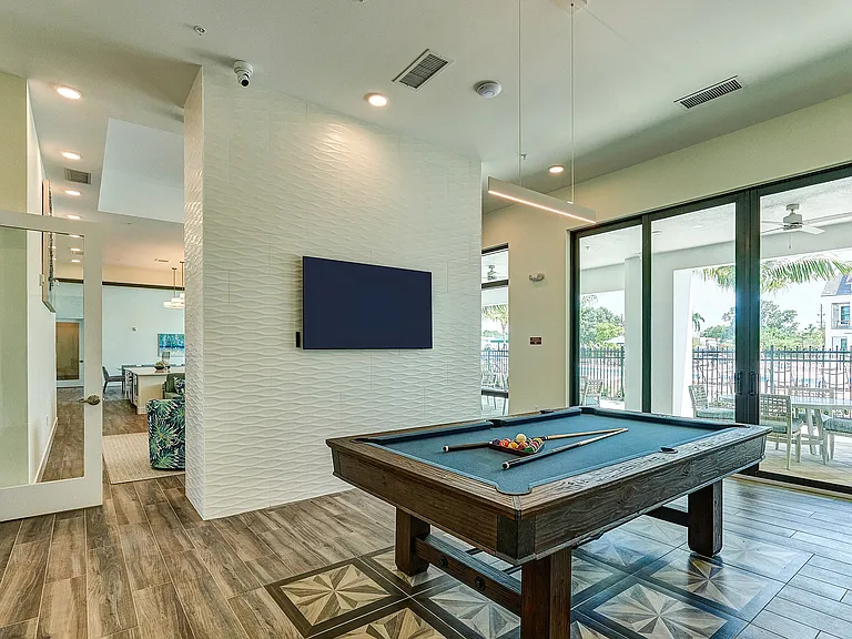Imperial Crossing Luxury Apartment Homes community clubhouse billiards area.
