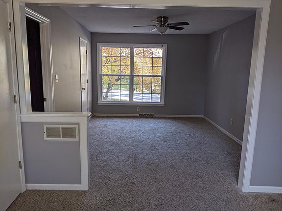 master bedroom has two walk in closets and a nice seating area or office area
