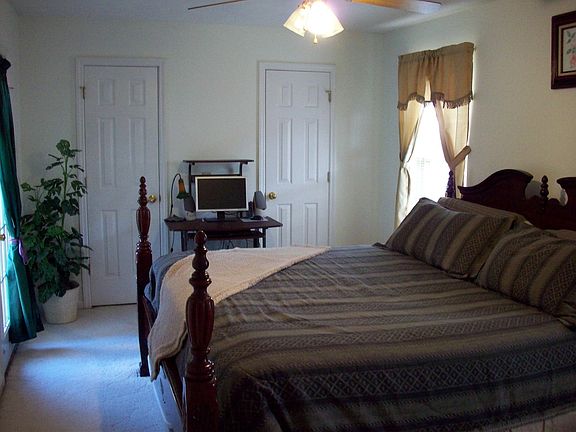 Master suite with lots of light, ceiling fan