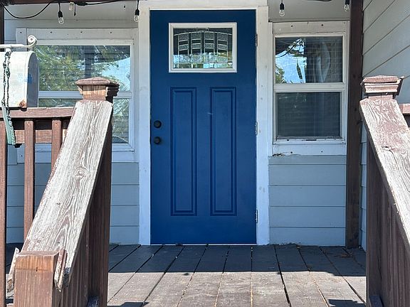The front doors are currently this gorgeous blue (previously yellow). Front door is brand new and impact rated.
