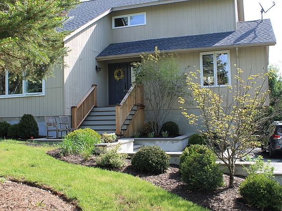Gorgeous new entryway : Cedar steps to front door and bluestone patio and brand new driveway