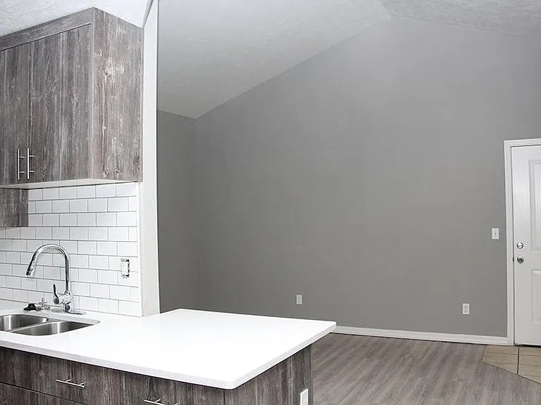 Renovated living room with vaulted ceilings.