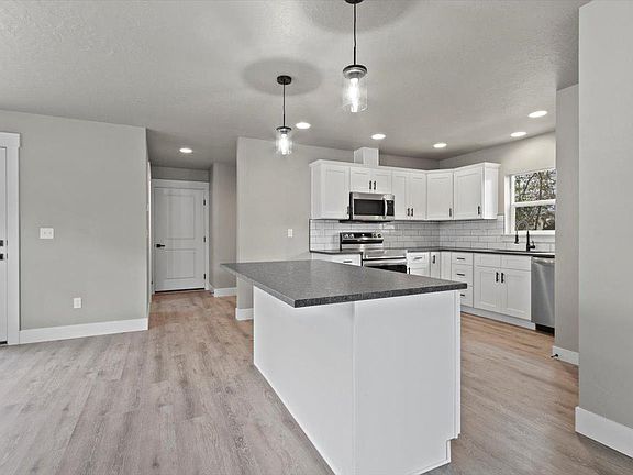 Dinning area / Island / Kitchen (photo similar)