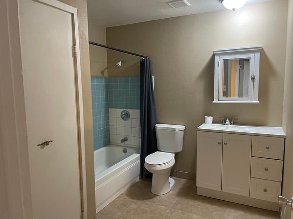 Hall bathroom with large storage closet