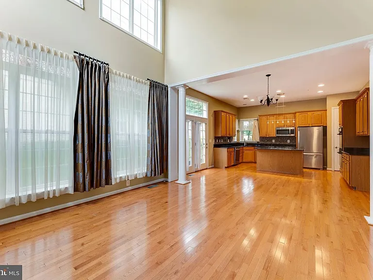 Great Room/ Family Room with 19' cathdral ceiling, lots of windows to let in natural light