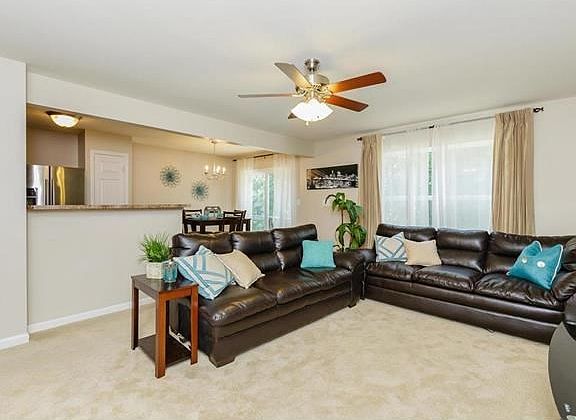 Entry foyer is wood and then you step into this plush family room. Neutral colors throughout enable 