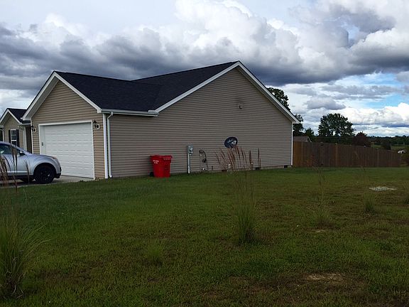 Side yard, 2 car garage