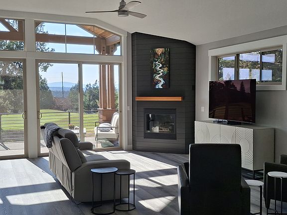 Gas fireplace in great room with a lovely view.