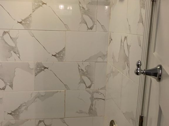 bathroom Full tub/shower view from sink area