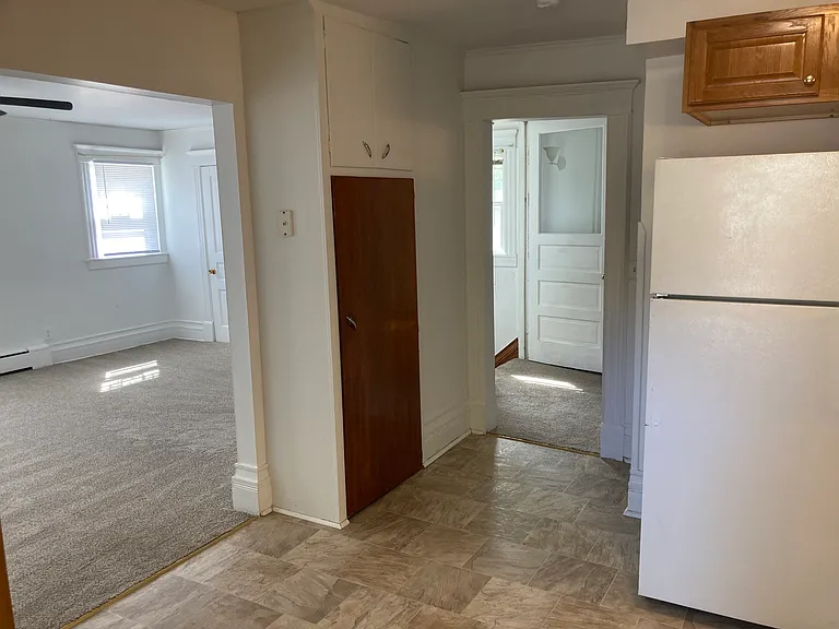 kitchen looking at living room and steps to go to 1st floor