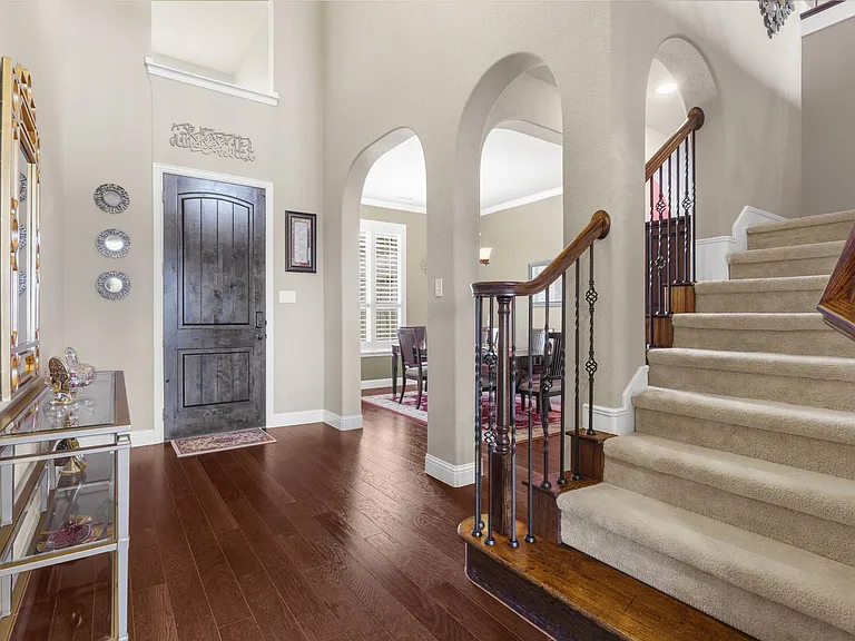 Classic design details & appointments from the moment you enter the home....soaring ceiling, hardwood floors, plantation shutters, archways & moldings. Recent updated mechanicals too: HVAC, water heater, whole home water filtration system. Roof only a few