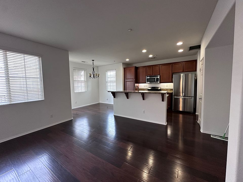 Living room, kitchen, dinning nook.