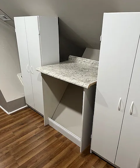 Pantry side of laundry/pantry room with convenient countertop