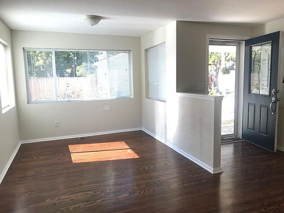 From the middle of the living/dining room looking back towards the front door.