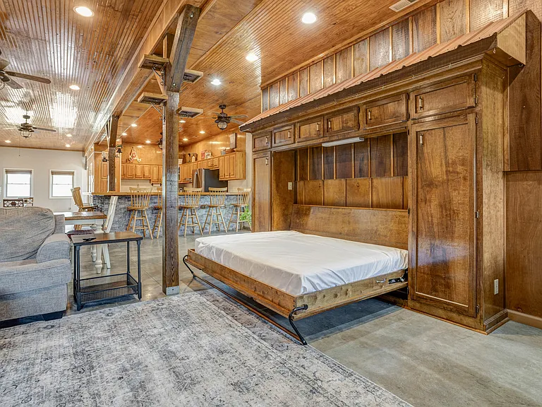 Queen size Murphy bed tucks away when not in use.