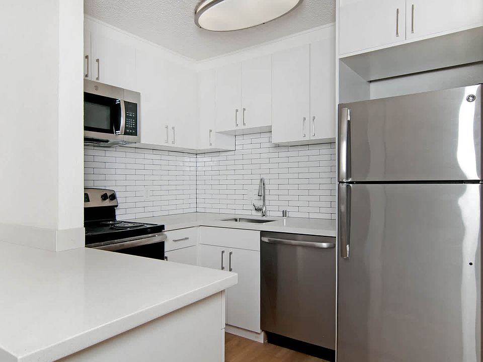 Kitchen with Quartz Countertops and Stainless Steel Appliances