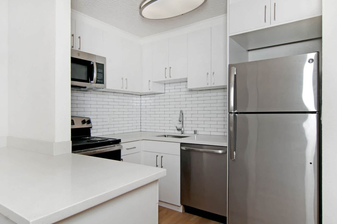 Kitchen with Quartz Countertops and Stainless Steel Appliances