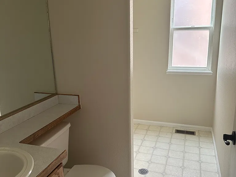 Main floor 1/2 bath and laundry area.