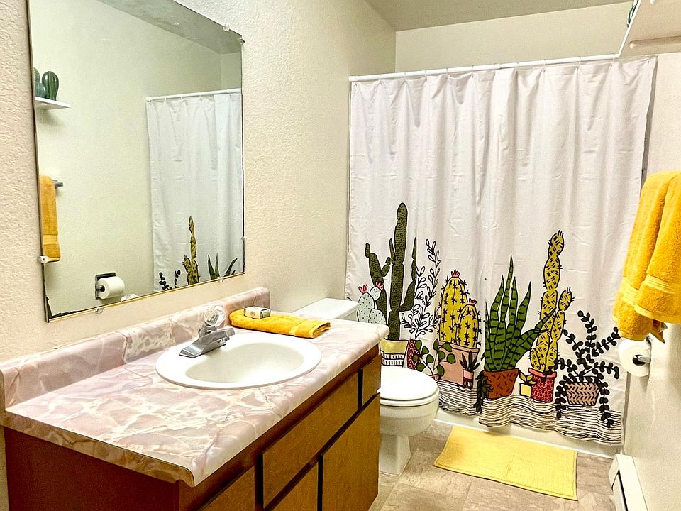 Large bathroom with linen closet, full bath, and shelving.