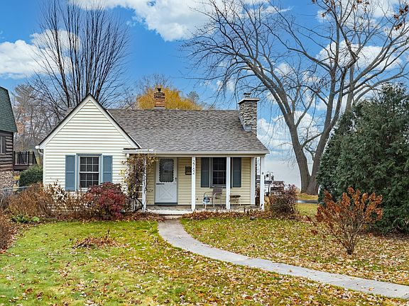 Cute house with a stone front porch that's perfect for watching the rain or waiting for visitors