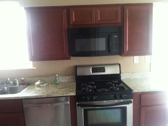 Gas stove, microwave, granite counters