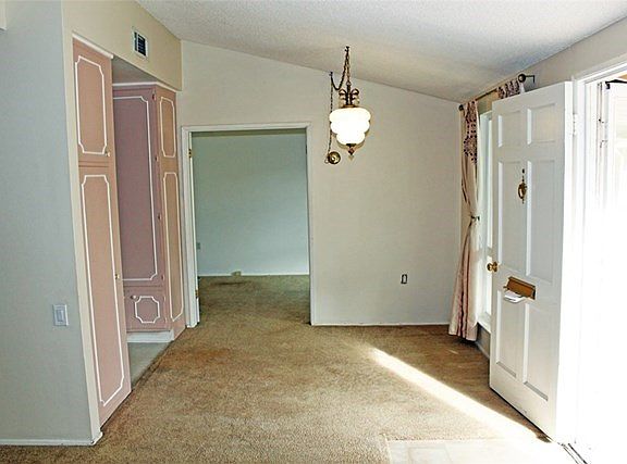 LIVING ROOM LOOKING TOWARDS DINING ROOM & MASTER BEDROOM, KITCHEN ON LEFT