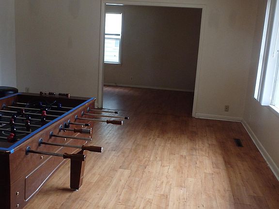 Living room with game room in back ground