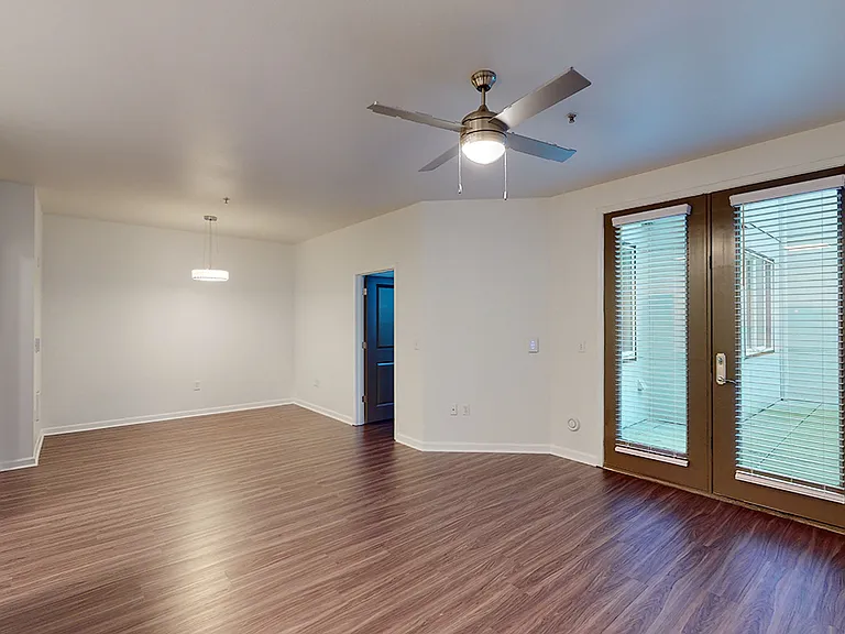 Living room with wood-style flooring.