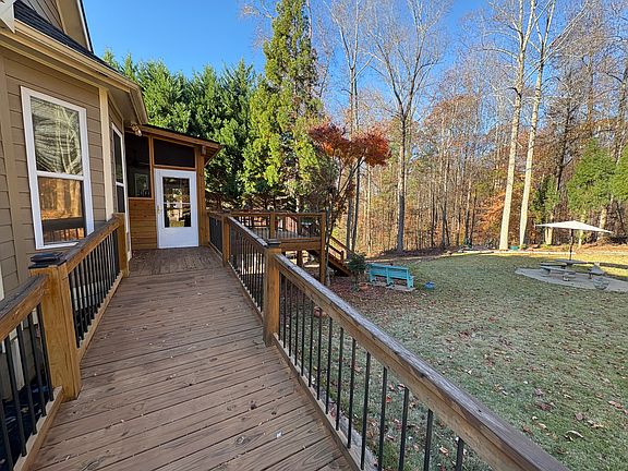 Driveway side ramp leading to screened deck area.