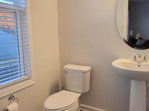 Guest powder room on kitchen/living level.