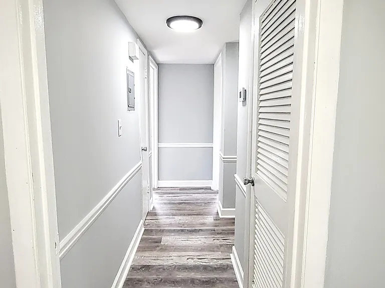 Another view of the bright & elegant hallway