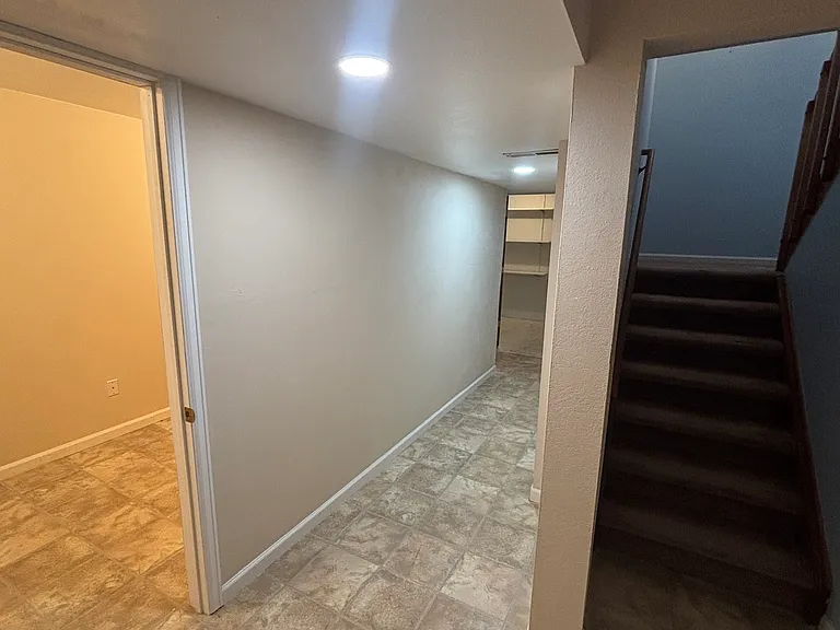 Finished Lower level with an additional room, storage areas, full bathroom and in unit laundry