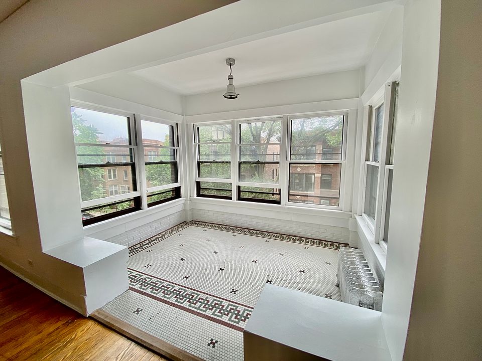 Gorgeous sun parlor overlooking stunning tree-lined street