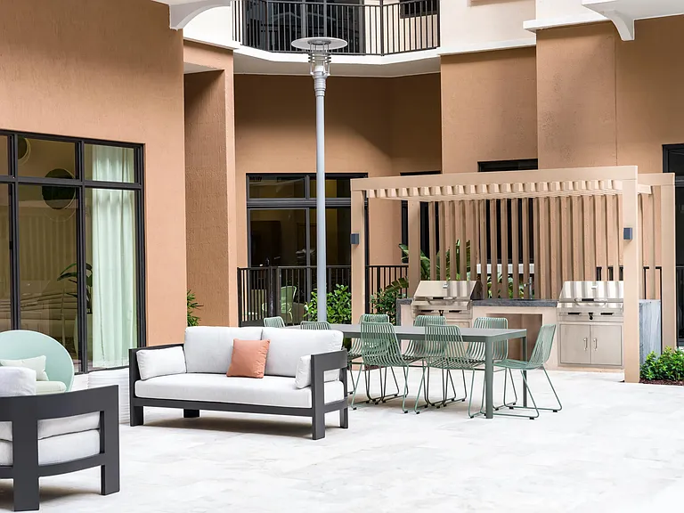 Savor every moment with an outdoor kitchen and grill by the pool.
