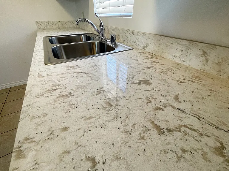 Quartz counters in kitchen and bathrooms