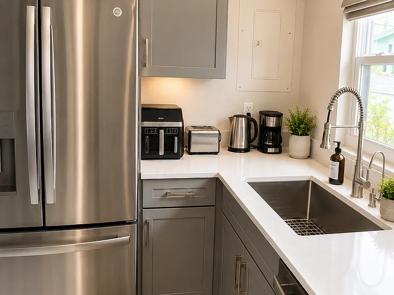 Enjoy a fully equipped renovated kitchen with brand-new stainless steel appliances and convenient extras like an air fryer, toaster, coffee maker, and kettle.