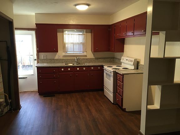 Kitchen has new granite, sink, faucet, and floor.