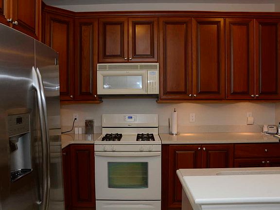 Stunning Upgraded Kitchen w/Stilestone Countertops, Glazed 42" Cabinets, Tile Floors.