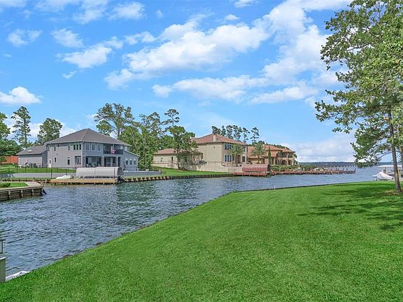 This perspective is taken from standing in your new backyard looking onto beautiful Lake Conroe.